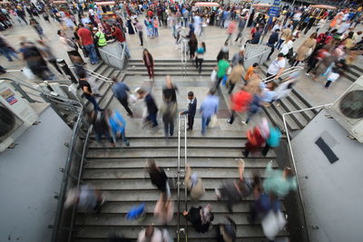 High angle view of people walking on street in city