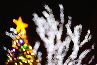 Close-up of illuminated christmas lights at night