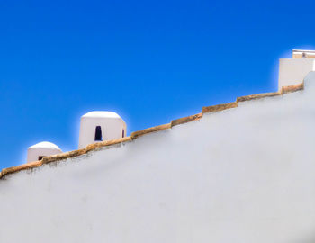 Low angle view of building against blue sky