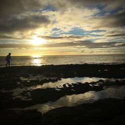 Scenic view of calm sea at sunset