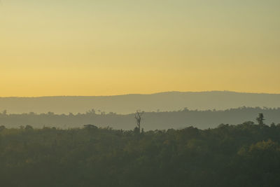 Scenic view of field against sky during sunset