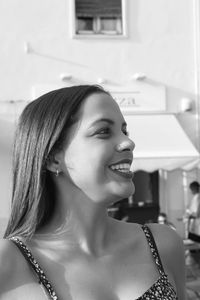 Portrait of a smiling young woman looking away