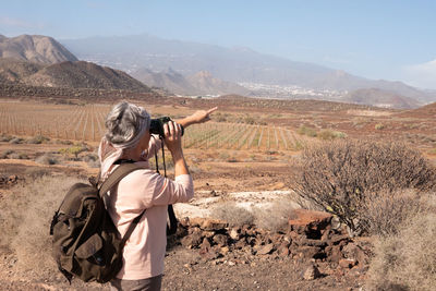 Senior woman hiking at remote location