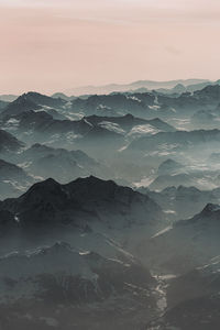 Scenic view of mountains against sky during sunset