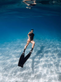 Woman swimming in sea