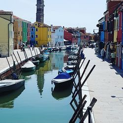 Boats moored at harbor