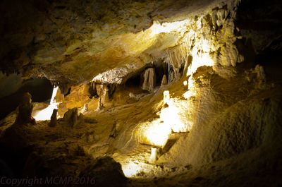Low angle view of illuminated cave