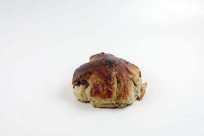 Close-up of bread against white background