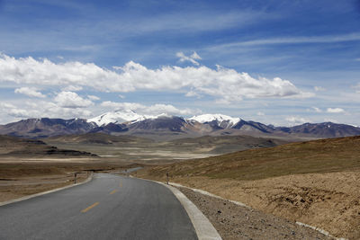 Empty road against sky