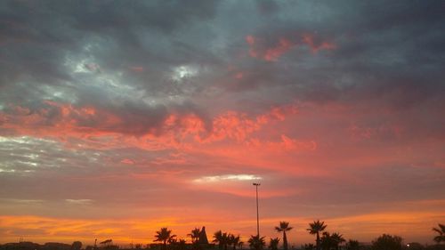 Low angle view of cloudy sky at sunset