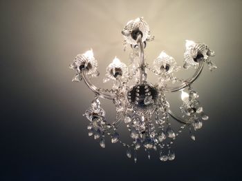 Low angle view of chandelier hanging from ceiling 