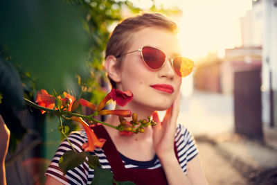 Portrait of young woman wearing sunglasses