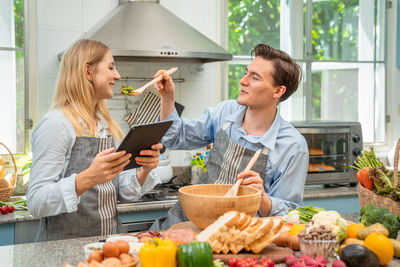 Young woman holding food on table