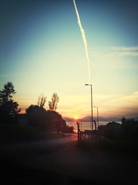 Scenic view of landscape against sky at sunset