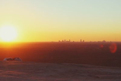 Scenic view of beach against sky during sunset