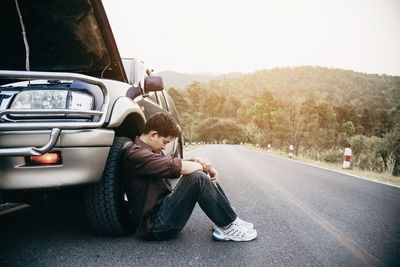 Man repairing car