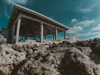 Built structure on beach against sky