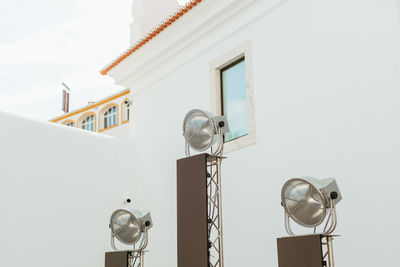 Low angle view of electric lamp on wall