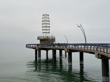 Pier over sea against sky