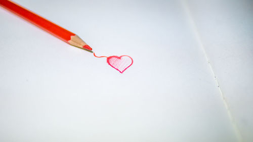 Close-up of heart shape on paper