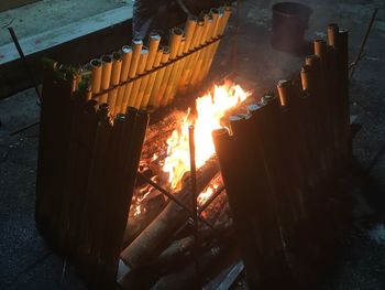 Close-up of bonfire on barbecue at night