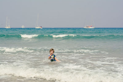 Happy little face in the sea