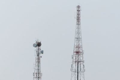 Low angle view of communications tower against clear sky