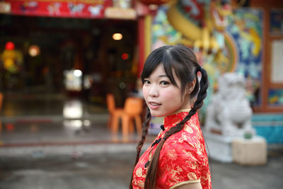 Portrait of woman standing outdoors