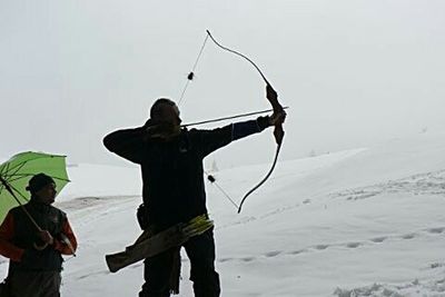 Woman standing in the dark