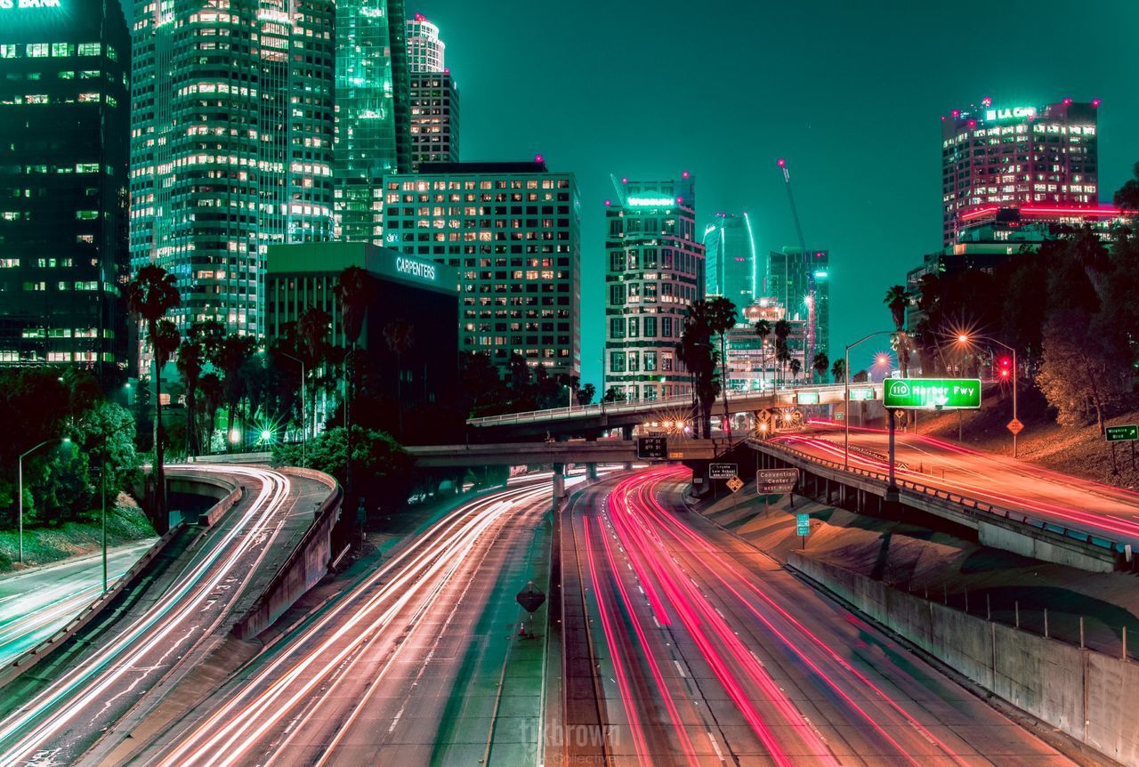 HIGH ANGLE VIEW OF LIGHT TRAILS ON ROAD