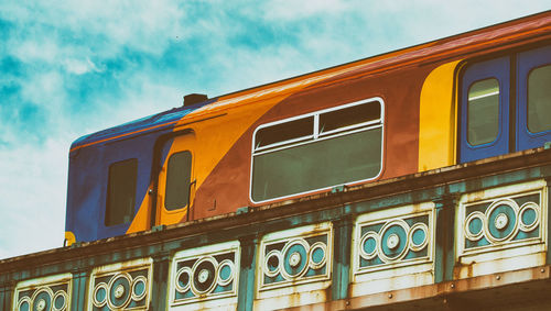 Low angle view of train against sky