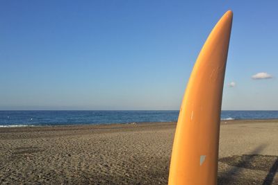 Scenic view of beach against clear sky