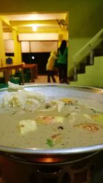 Close-up of food in illuminated kitchen