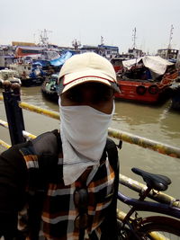 Portrait of man moored at harbor