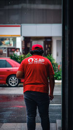 Rear view of man standing on street