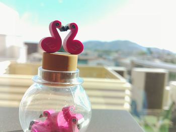 Close-up of red bottle on table