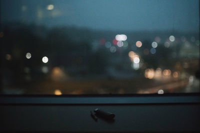 Close-up of illuminated lights on glass window