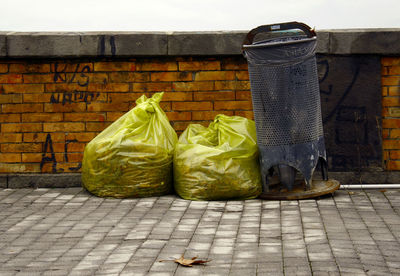 Containers against brick wall