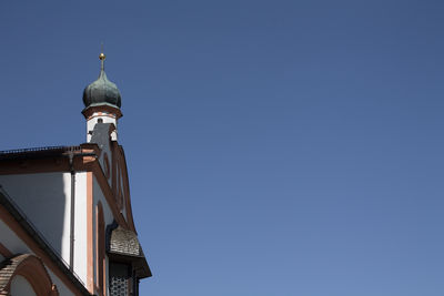 Low angle view of church against blue sky