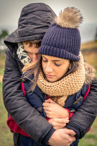 Couple romancing on field