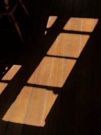 High angle view of shadow on floor