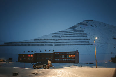 Cars on road against clear sky