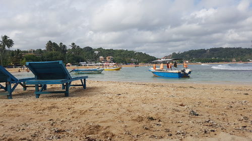 Boats moored in sea