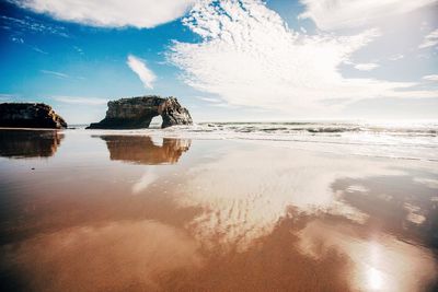 Scenic view of sea against cloudy sky