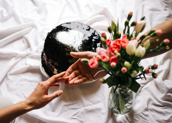 Midsection of woman holding crystal ball