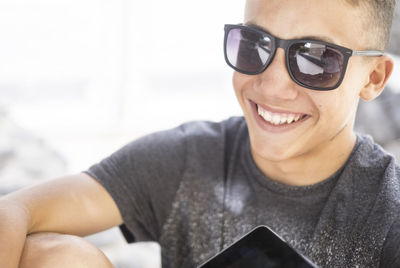 Portrait of young man wearing sunglasses