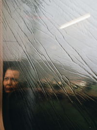 Woman seen through window