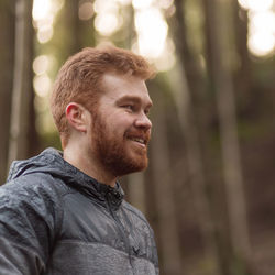 Close-up of young man looking away outdoors