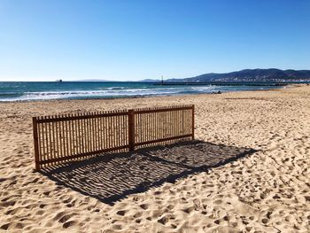 Scenic view of beach against clear sky