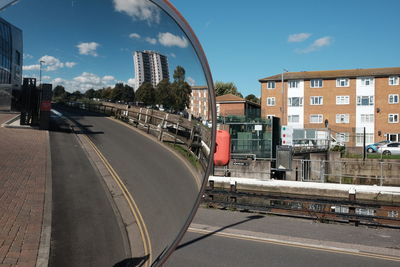 Cars on city against sky